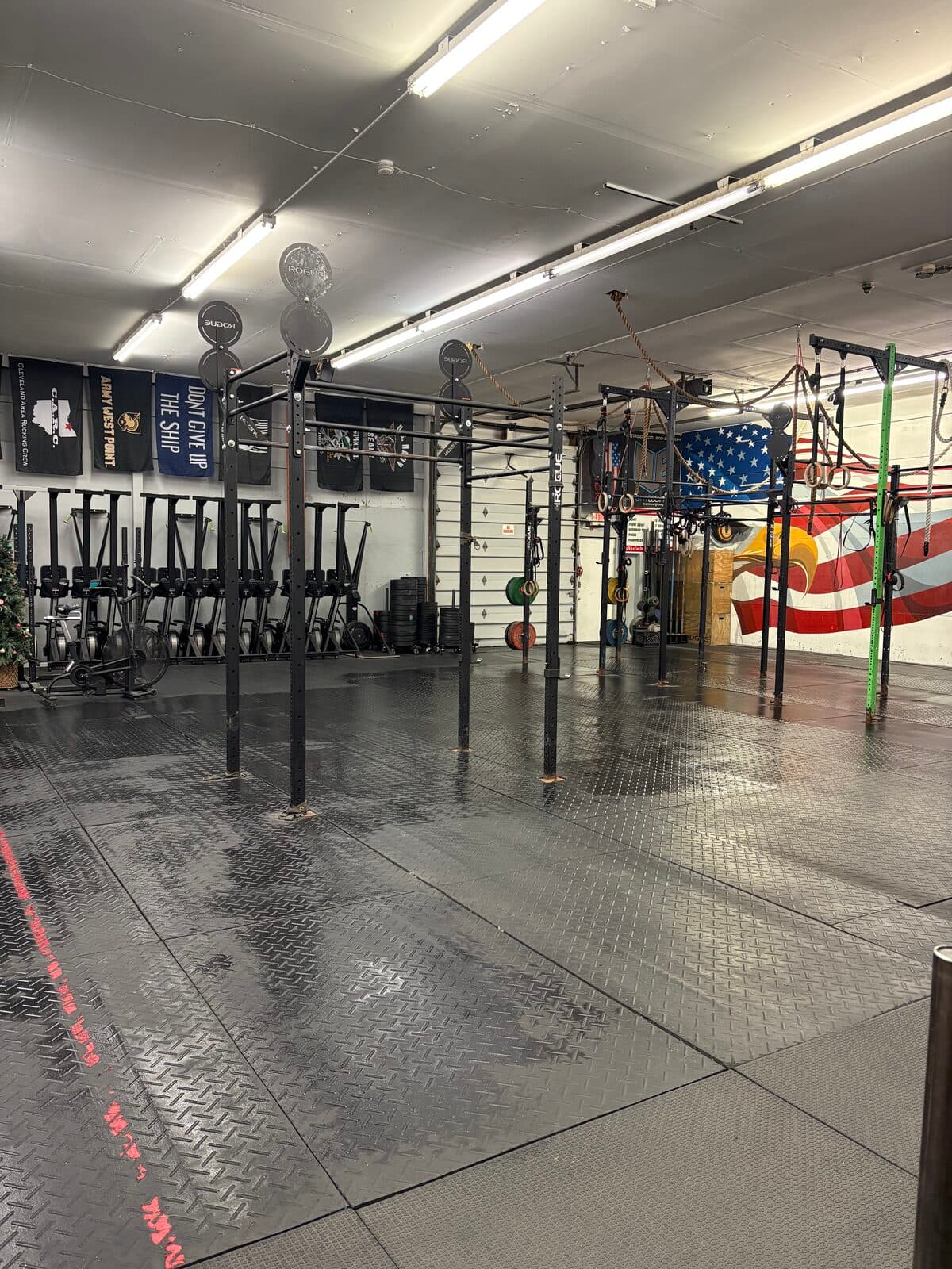 The Erie Shore Athletics training floor with rigs, flags and equipment